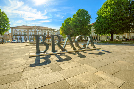 Braga, Portugal - August 12, 2017: Braga Sign of city in Praca do Municipio, Braga downtown, North of Portugal. Braga City Hall on background. Sunny day in the blue sky.のeditorial素材