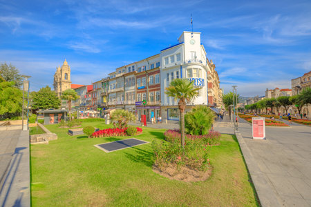 Braga, Portugal - August 12, 2017: Praca da Republica known as Arcade crossing Avenida da Liberdade with Tourist Office of Braga and Convent of Congregados on background. Cityscape in a sunny day.のeditorial素材