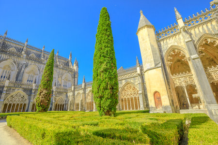 Batalha, Portugal - August 16, 2017: Courtyard of Batalha Monastery or Saint Mary of the Victory  Gothic architecture in Portugal, mixed with Manueline styleのeditorial素材