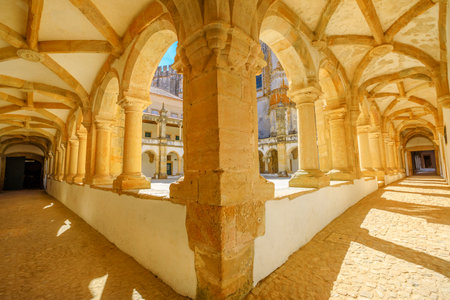 Tomar, Portugal - August 10, 2017: perspective view of the double porch inside Claustro da Hospedaria or Guests in Templar Castle of Tomar or Convent of Christ. Unesco Heritage and popular place.のeditorial素材
