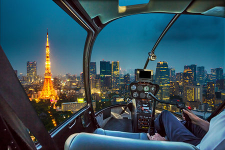 Helicopter flying on Tokyo Skyline at dusk with illuminated Tokyo Tower, icon and landmark of Minato Distric in Tokyo, Japan.のeditorial素材