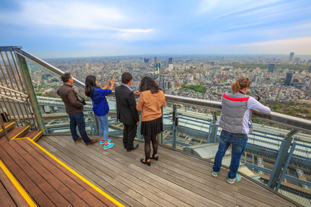 Tokyo, Japan - April 20, 2017: people looking Tokyo Skyline from observatory atop of Mori Tower, the modern skyscraper and tallest building of the Roppongi Hills complex, Minato Tokyo.のeditorial素材