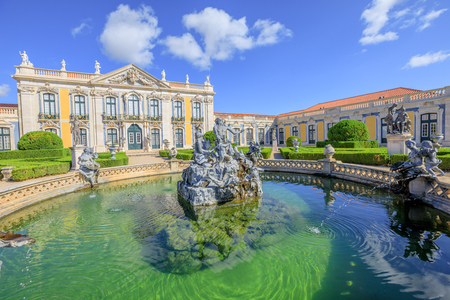 Baroque facade of Queluz National Palace and Neptune Fountain in Sintra, Lisbon district. Defined as the Versailles of Portugal, the Royal Palace of Queluz was used as a fun place for the royal familyの写真素材