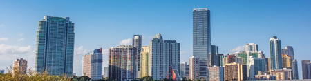 Panorama of Miami skyscrapers and skyline. Miami South Beach in Downtown District in sunny day. Apartment and business buildings in Miami Beach, Florida.の写真素材