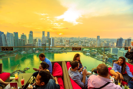 Singapore - May 3, 2018: lifestyle people enjoy sunset and panoramic views from rooftop SkyBar CE...