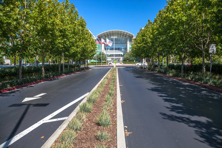 Cupertino, CA, United States - August 15, 2016: road to Apple world headquarters at One Infinite Loop. Apple is a multinational that produces consumer electronics, personal computers and software.のeditorial素材