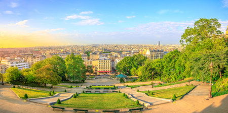 Scenic panorama of Paris at sunset and skyline above Paris. Wide angle view of staircase of Sacred Heart Church from terrace of Cathedral, the highest city point of Paris in Montmartre, France.の写真素材