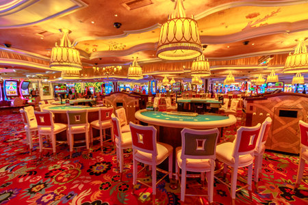 Las Vegas, Nevada, United States - August 18, 2018: blackjack tables and slot machine inside the luxurious Wynn Las Vegas Resort Hotel, a 5-star, themed Paradise in Las Vegas Strip.のeditorial素材