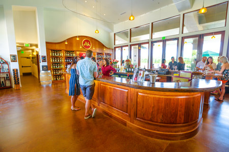 Los Olivos, California, USA - August 11, 2018: couple at Vincent Vineyards and Winery, Santa Ynez, a producer of the finest French Cabernet varieties that cultivate some of the highest quality grapes.のeditorial素材