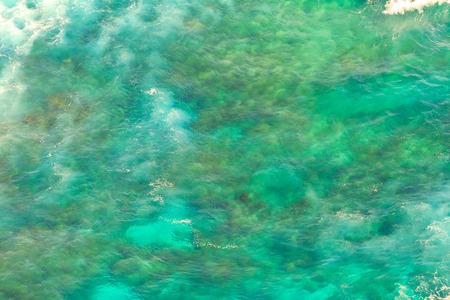 Aerial view Indian Ocean with tropical reef. Marine background texture of turquoise sea. Drone top view of nature sea tropical wallpaper. Copy space. Horizontal shot.の写真素材