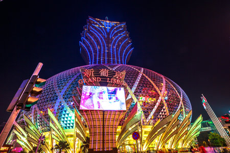 Macau, China - December 8, 2016: Grand Lisboa Casino at night, the largest casino in the world by extension that includes the tallest tower in Macao and a colorful giant dome.のeditorial素材