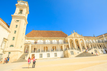 Coimbra, Portugal - August 14, 2017: people at iconic University Clock Tower in Paco das Escolas. The University of Coimbra is the most ancient of Portugal and also one of the oldest in Europe.のeditorial素材
