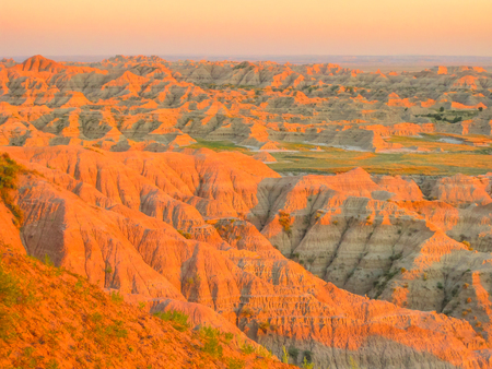 Colorful eroded pinnacles of Badlands National Park in South Dakota, United States at sunset light. American travel destination.の写真素材