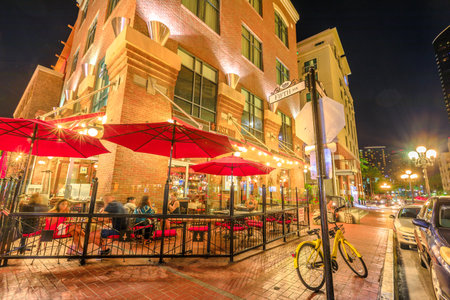 San Diego, California, United States - July 31, 2018: people eats at Tuscan Cafe and Wine Bar on Fifth Avenue, the main street of Gaslamp Quarter, a Historic District of Downtown of San Diego by nightのeditorial素材