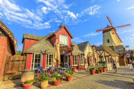 Solvang, California, United States - August 10, 2018: Old Windmill in Santa Ynez Valley, Santa Barbara County. Solvang is a Danish Village with typical architecture. Sunny blue sky. Famous place.のeditorial素材