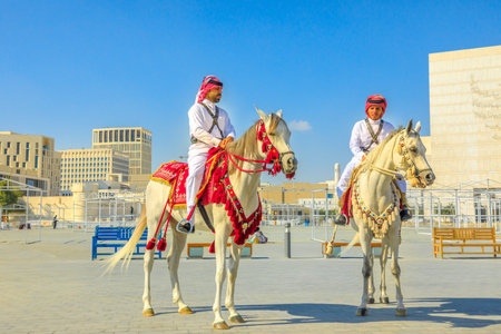 Doha, Qatar - February 20, 2019: two heritage Police Officers in traditional 1940s Qatari uniform...