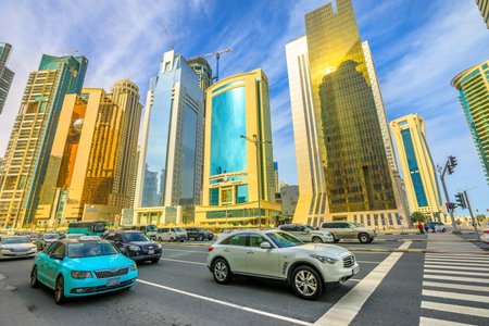 Doha, Qatar - February 17, 2019: street view and urban traffic from City Center Mall of glassed...