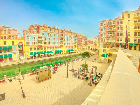 Doha, Qatar - February 16, 2019: aerial view of Venetian Rialto bridge and canal at picturesque...