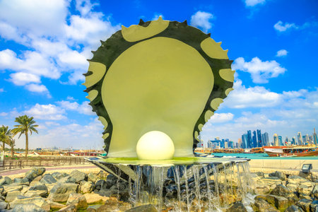 Doha, Qatar - February 20, 2019: closeup of iconic Oyster and Pearl Monument with fountain on...
