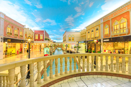 Doha, Qatar - February 21, 2019: balcony at venice canal in Villaggio Mall, a shopping center in Aspire Zone. Luxury brands, expensive stores and exclusive shops in shopping mall with venetian style.のeditorial素材