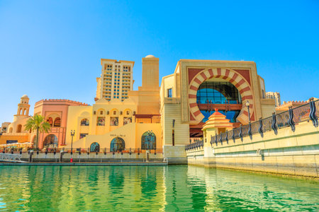 Doha, Qatar - February 18, 2019: bridge on canals of Porto Arabia marina, the Pearl-Qatar, Doha. Persian Gulf in the Middle East. Corniche at the Pearl, an artificial island in Doha.のeditorial素材