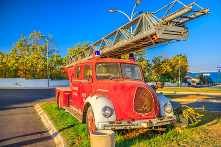Lagos, Portugal - August 22, 2017: vintage fire truck of fire department of Lagos city on the beach. Algarve Coast of Portugal.のeditorial素材