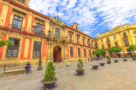 Seville, Andalusia, Spain - April 18, 2016: facade of Archbishops palace in Plaza Virgen De Los Reyes square. Seville is an artistic city and tourist destination.のeditorial素材