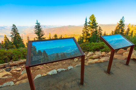 Kings Canyon National Park, California, United States - August 10,2019: sunset panorama on top of Kings Canyon with view of Sierra Nevada and Sequoia National Forest. Interpretive sign information.のeditorial素材