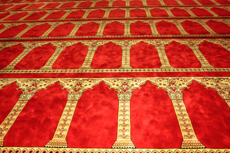 Acre, Israel - Dec 31, 2020: red carpet texture inside the Al-Jazzar Mosque of the old city of Acre or Akko town, Historical 1781 Mosque located on el-Jazzar Street.のeditorial素材