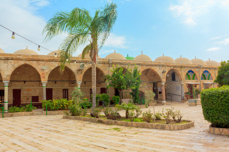 Acre, Israel - Dec 31, 2020: Al-Jazzar Mosque cloister of the old city of Acre or Akko town, Historical landmark of 1781 located on el-Jazzar Street. Acre town is an UNESCO World Heritage site.のeditorial素材