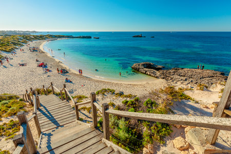 Rottnest Island, Western Australia - Jan 4, 2018: Stairs leading up to Bathurst Lighthouse in north coast of Rottnest Island, near Perth, Western Australia. Tourists swimming in the beach.のeditorial素材