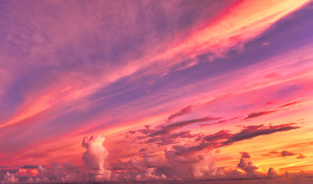 nature background of Summer pink and red sky with moving clouds. sun shining at sunset of Seychelles...