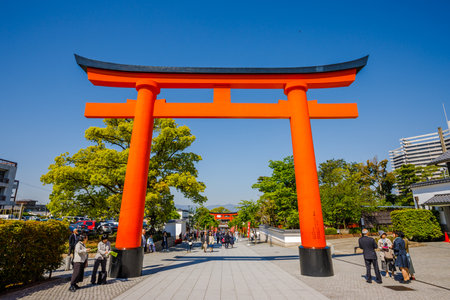 Kyoto, Japan - April 28, 2017: Red Torii gates at Fushimi Inari Taisha with tourists and Japanese students. Fushimi Inari is the most important Shinto sanctuary.のeditorial素材