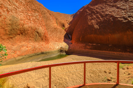 Uluru, Northern Territory, Australia - Aug 24, 2019: Mutitjulu Waterhole at the end of Kuniya walk in Uluru-Kata Tjuta National Park, Red Center in Australian outback.のeditorial素材