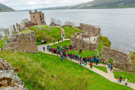 Loch Ness, Scotland, United Kingdom - May 24, 2015: tourists visiting Urquhart Castle beside Loch Ness lake. Visited for the legend of the Loch Ness monster: Nessie.のeditorial素材