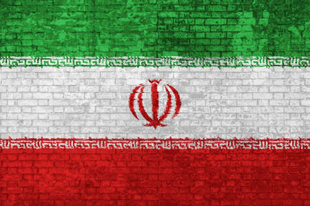wall of bricks painted with the Iranian flag isolated background. Islamic Republic of Iran flag 3D illustration. Concept of social barriers of immigration, divisions, and political conflicts in Iran.の写真素材