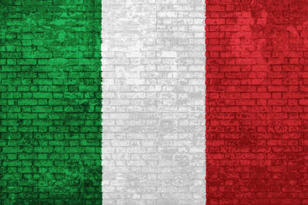 wall of bricks painted with the flag of Italy, green white and red colors. 3d background. Concept of social barriers of immigration, divisions, and political conflicts in Italy.の写真素材
