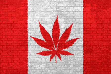 wall of bricks painted the Canada flag with Marijuana leaf. Cannabis legalization. Concept of social divisions, and political conflicts for Cannabis legalization in Canadaの写真素材