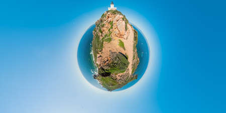 tiny planet of aerial 360 panoramic view of Sanguinaires islands of Corsica in France. Drone view of seascape and the lighthouse with the Genoese tower in Mediterranean sea and tourists.の写真素材