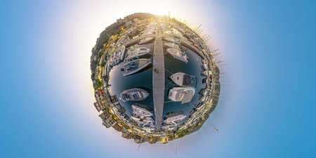 Aerial 360 tiny planet of Porto Vecchio city harbor at night in Corsica island of France. Drone view...