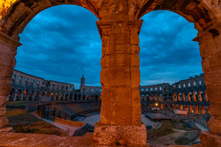 Pula Amphitheater at night, also known as Coliseum of Pula in Croatia, is a well-preserved Roman amphitheater in Pula, Istria, Croatia. ancient arena was built in 27 BC - 68 AD by Roman Empireのeditorial素材