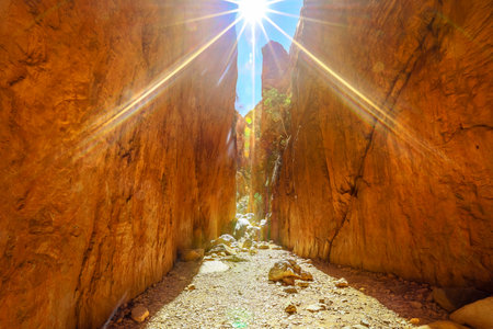 Mid-day sun rays over a gorge canyon Standley Chasm,Aboriginal Land, West MacDonnell Ranges. Angkerle Atwatye is spectacular geological icon of Central Australia. Outback Red Centre Northern Territoryの写真素材