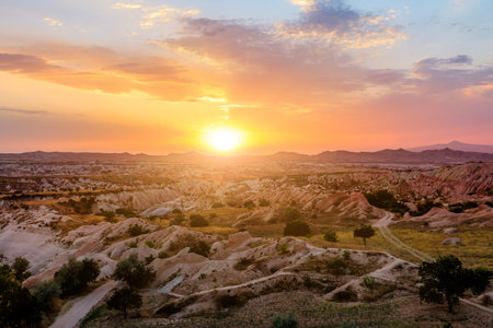 Cappadocia sunset with vibrant colors, captures the final beams of sunlight, casting luminous glow...