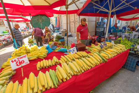 Eskisehir, Turkey - Aug 2,2023:Within enchanting booths of Eskisehir bazaar, both residents and tourists relish an experience that tantalizes the senses, delving into diverse selection of fresh fruitsのeditorial素材