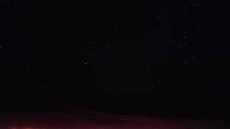 Star-trail timelapse of blue night sky with milky way, stars field and galaxies, from dunes of Empty quarter desert or Rub al-Khali desert on Jannuary in Oman.の写真素材