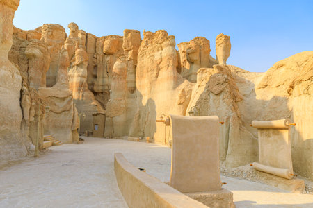 Stone scrolls and panels resembling ancient manuscripts line the pathway between Jabal Al Qarah caves, forming an open-air museum that celebrates local heritage in Al Ahsa, Saudi Arabiaの写真素材