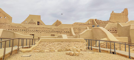 Traditional Najdi architecture in Diriyah, historic city near Riyadh, features mud-brick buildings...