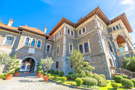 Cantacuzino Castle, stone landmark featuring intricate architecture and decorative elements, presenting ideal travel destination in the scenic Carpathian Mountains of Busteni, Transylvania of Romaniaの写真素材
