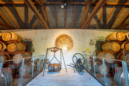 Sainte-Marie, Martinique, French Antilles - Dec 27, 2025: Habitation La Salle distillery featuring Rhum Agricole Saint James barrels, historic weighing scale, and vintage equipment in Sainte-Marieのeditorial素材