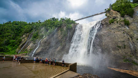 Insane view of Montmorency waterfall from the bottom. Only 10kms away from Quebec City. That waterfall is amazing because superpowerful. Pretty easy to get wet when you admire it from the bottom!の写真素材